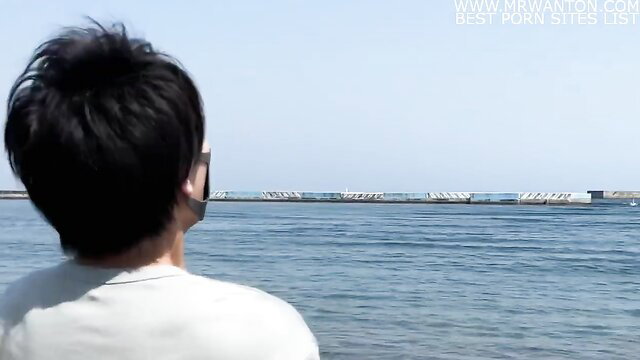 Emuyumi Couple man gazes at sea bridge on hot spring trip