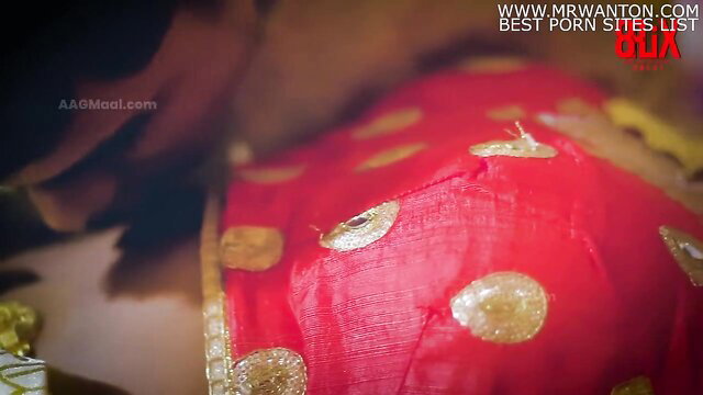 Indian bride Bebo in red polka dot saree, cleavage tease from Bebo Wedding Uncut
