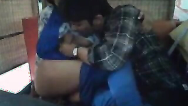 Indian couple kissing passionately, guy orally caressing tits