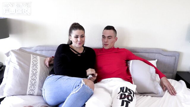 Aali Kali cuddles boyfriend on bed in ripped jeans sweater