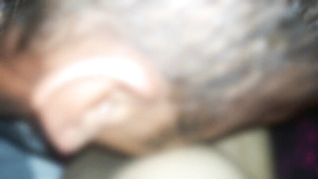 Blurry closeup of Indian wife's gray-haired Colombian hubby showing ear and neck