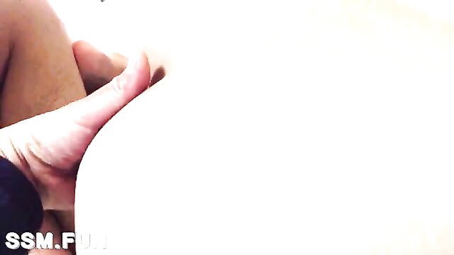 Woman's hand grips thick Asian cock close-up in uncensored gay lust scene