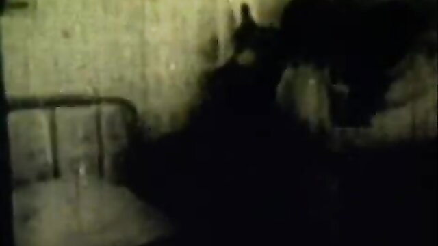 Vintage retro erotic couple in bed, shadowy intimacy