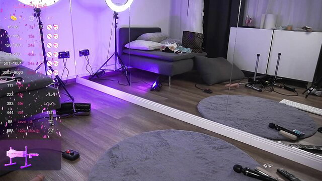 Vanesa Simon's webcam bedroom setup with toys and purple lights
