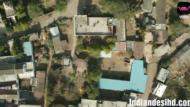 Aerial drone view of Indian village houses with Voovi watermark