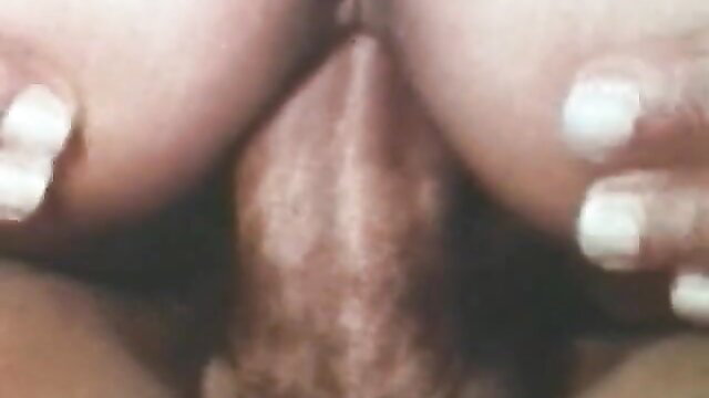 Vintage 8mm closeup of black hottie with big natural tits titfucking thick cock