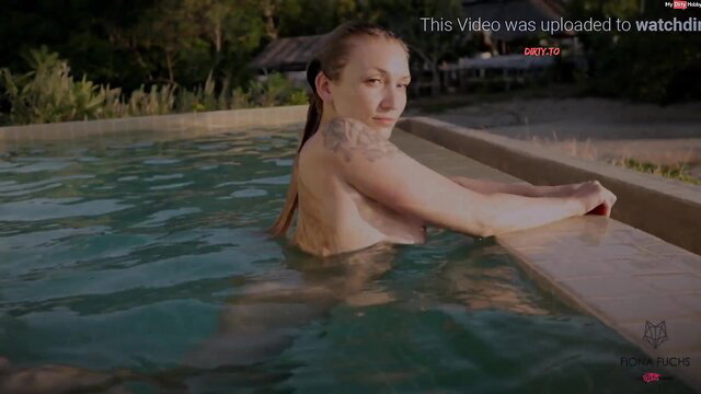 Fiona Fuchs nude in pool, massive tits out, wet blonde tattooed beauty