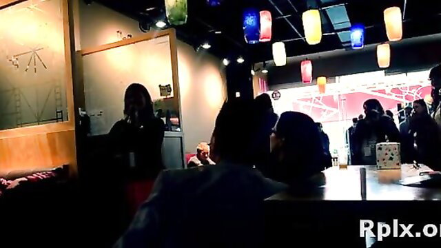 Romantic brunette Japanese floozy in steamy bar crowd scene