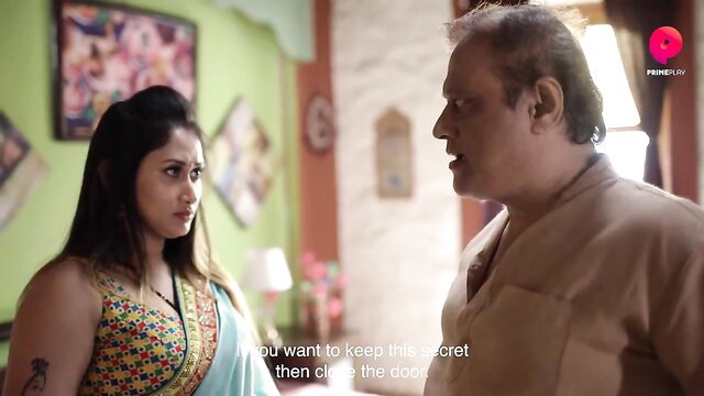 Indian Ko Ko in saree with older man, intense secret talk closeup
