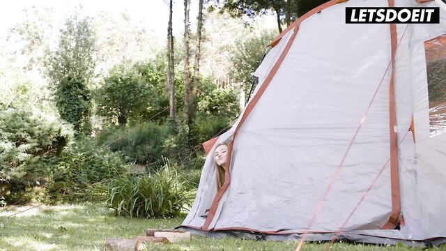 Skinny wife peeking from tent outdoors in Horny Hostel cheating scene