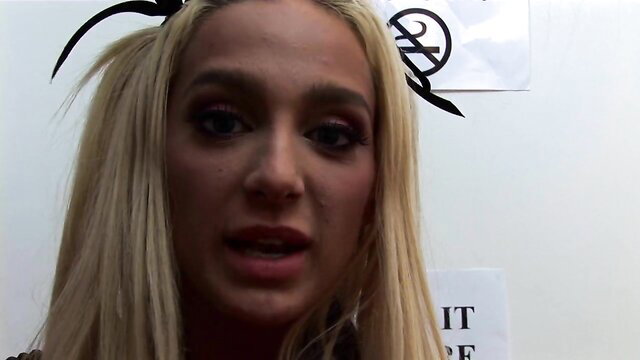 Blonde British babe with big boobs in demon horns headband closeup