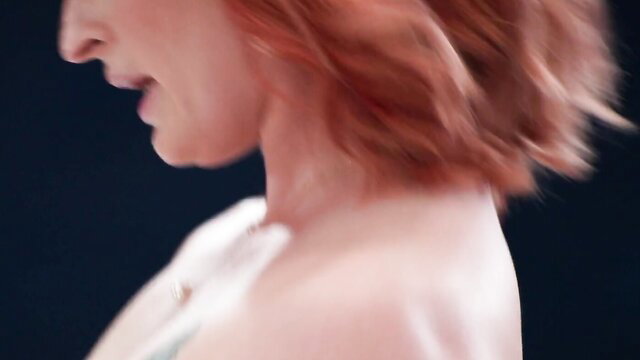 Queen Mirage redhead MILF profile closeup, sexy lips and neck