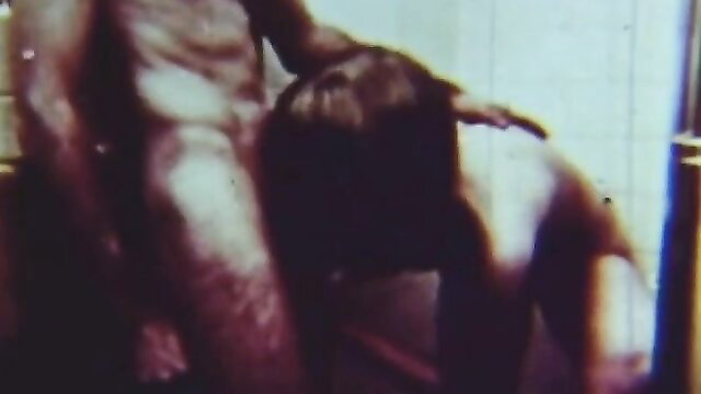 Hairy MILF fucked doggystyle by plumber in retro bathroom scene