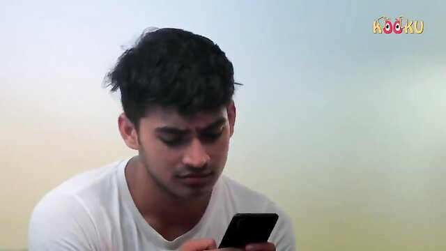 Handsome Indian nephew texts on phone in white tee, hot aunt-nephew taboo preview