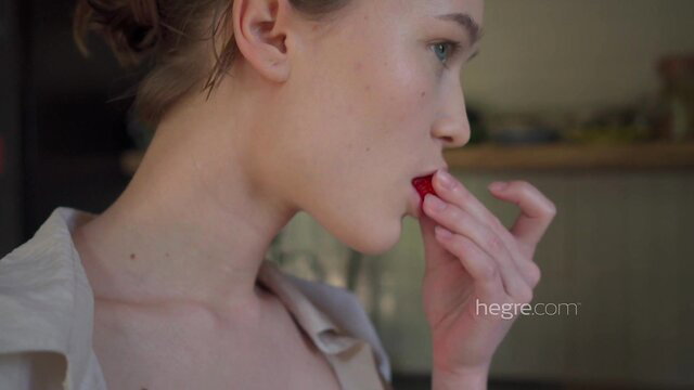 Margo V from Carpathians Ukraine seductively eats red candy closeup