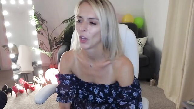 Blonde MFC camgirl MarthaMayer in off-shoulder dress on MyFreeCams