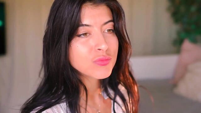 Stunning Arab brunette with plump lips in sexy white top, teasing pout