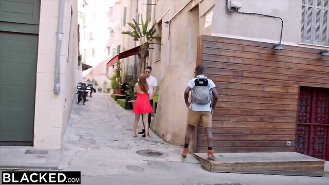 Grateful blonde Mina in red dress thanks black knight EboBlack in sunny alley