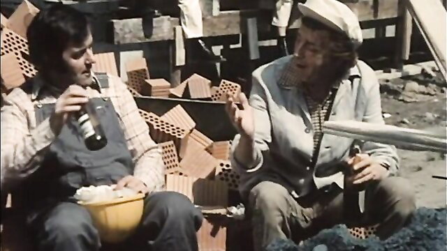 Two men chatting with beers on vintage German porn set Schulmadchen Report 06 1973