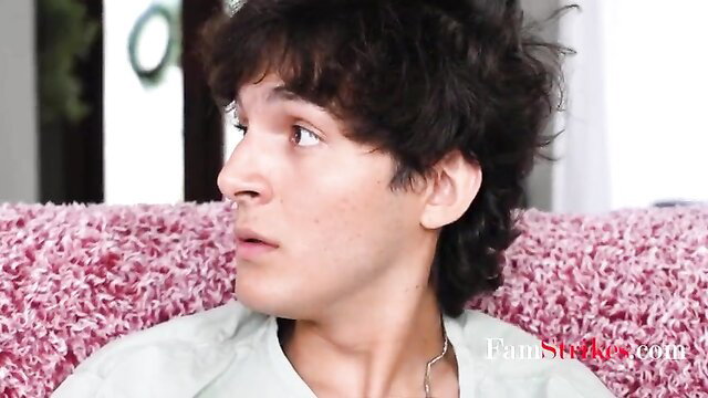 Handsome young man with curly hair on pink couch in Anissa Kate MILF video
