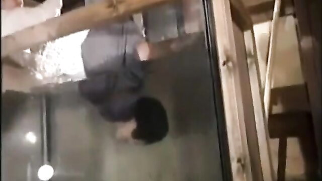 Vintage Asian woman bound in BDSM pose, suspended upside down