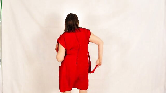 Hawt granny in red dress stripping, showing massive tits & curves