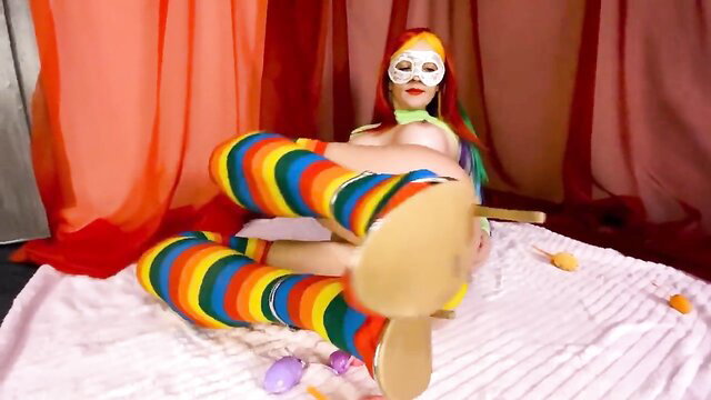 Colorful clown MILF spreads legs in striped stockings, teasing feet and soles
