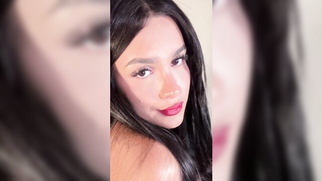 Viviana trans Latin beauty with sultry eyes and red lips teasing closeup