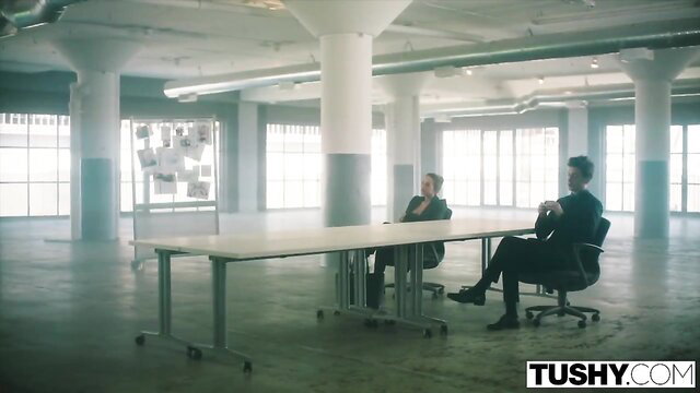 Abigail in office meeting with suited men, Tushy feature showcase