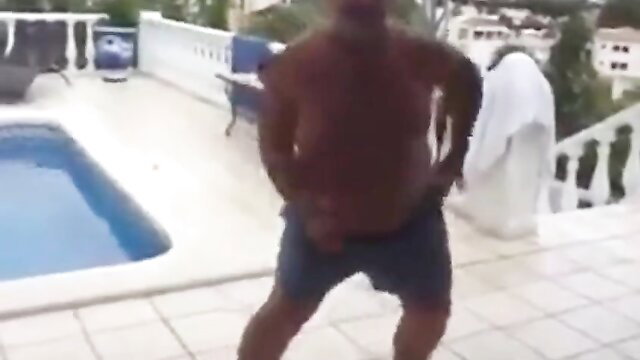 Tacata Bear 2: Chubby black daddy bear dances shirtless by pool in shorts