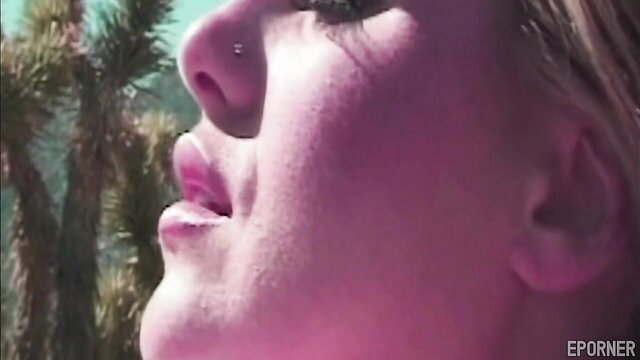 Closeup of blonde babe's face outdoors, natural vibes Selena style