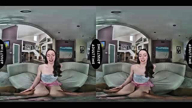 Oliver Davis smiling topless on couch in VR porn thumbnail