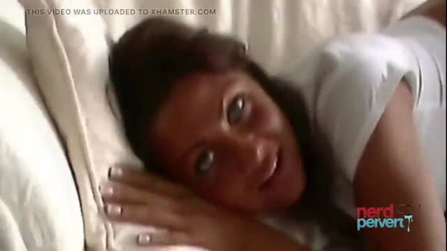 Viola Von Vild lying in bed smiling in white shirt