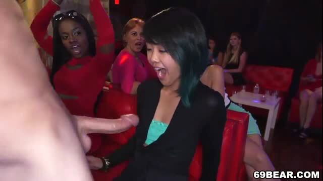 Asian woman in black blazer receives CFNM blowjob at party