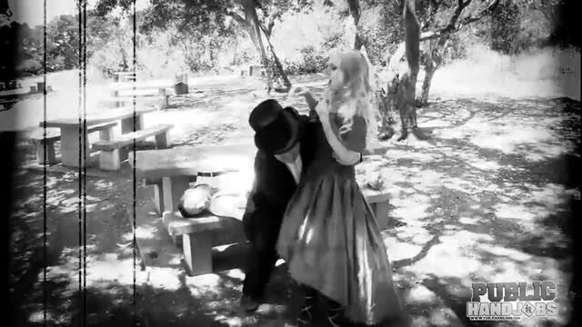 Christie Stevens in vintage dress giving handjob outdoors