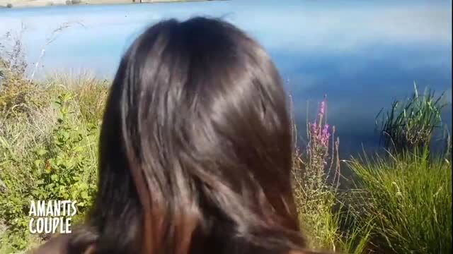 Brunette teen outdoors near river in nature