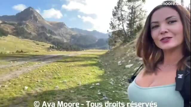 Ava Moore in tight top outdoors in mountain landscape