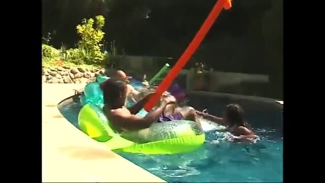Group sex by the pool with couples on inflatables and in water