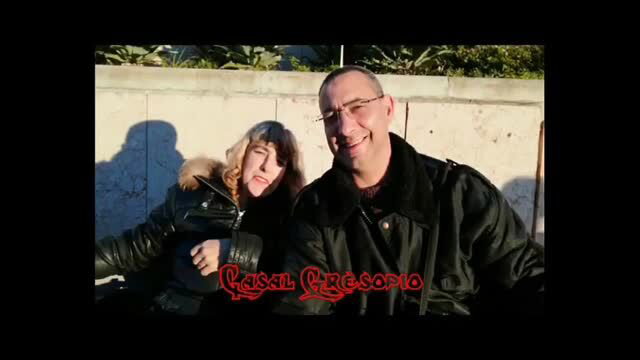 Couple smiling together outdoors in winter jackets
